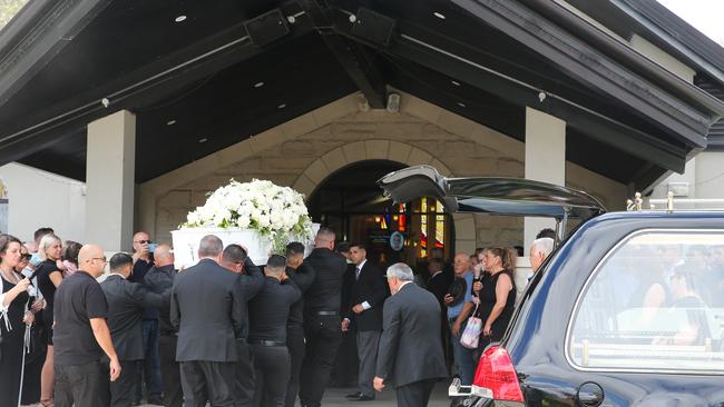 The coffin is carried into St John the Beloved Church, Mt Druitt. Picture NCA Newswire / Gaye Gerard