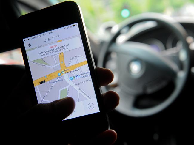Uber allows customers to book a car through an app. Picture: AFP/DPA/Britta Pedersen