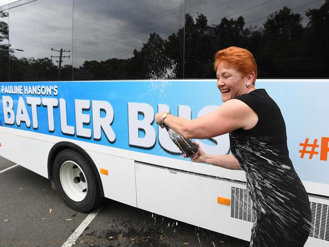 One Nation leader Pauline Hanson pops a bottle of Yellowglen on the campaign trail in Brisbane yesterday. Picture: Dave Hunt/AAP