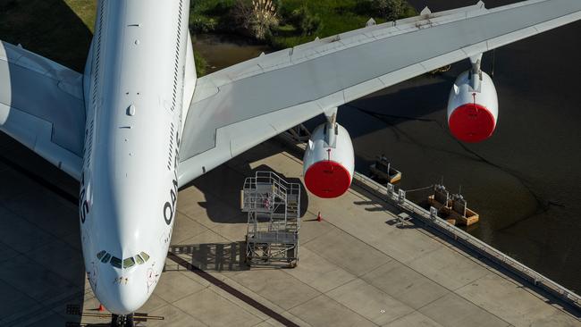 A grounded Qantas plane is parked on the tarmac at Sydney Airport. Photo: Getty Images