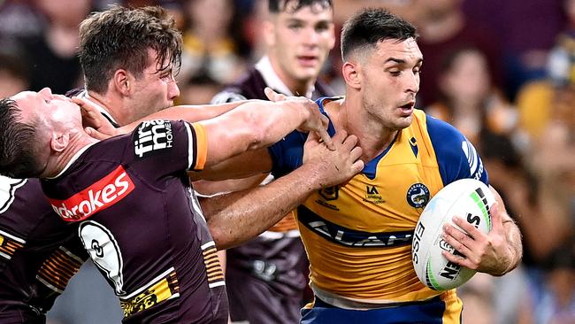 BRISBANE, AUSTRALIA - MARCH 12: Ryan Matterson of the Eels attempts to break away from the defence during the round one NRL match between the Brisbane Broncos and the Parramatta Eels at Suncorp Stadium, on March 12, 2021, in Brisbane, Australia. (Photo by Bradley Kanaris/Getty Images)