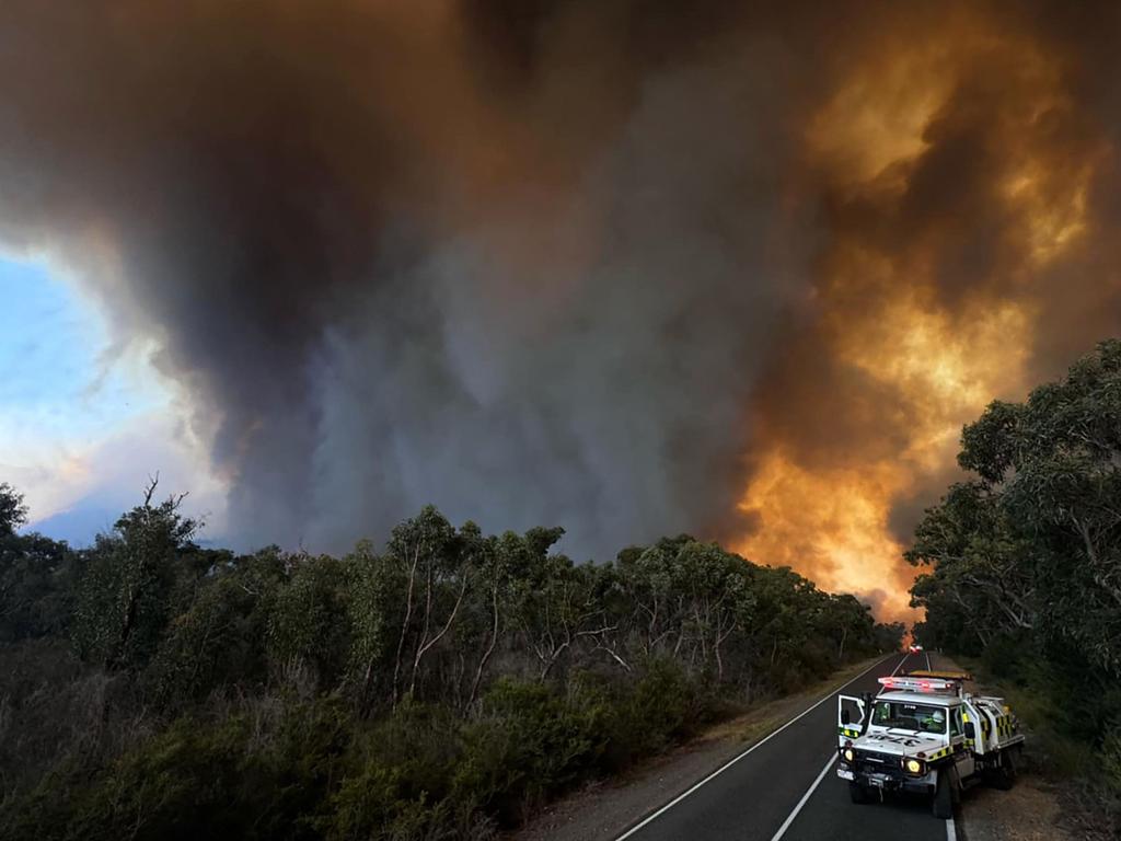 Officials on a road near a bushfire in the Grampians National Park. Picture: AFP