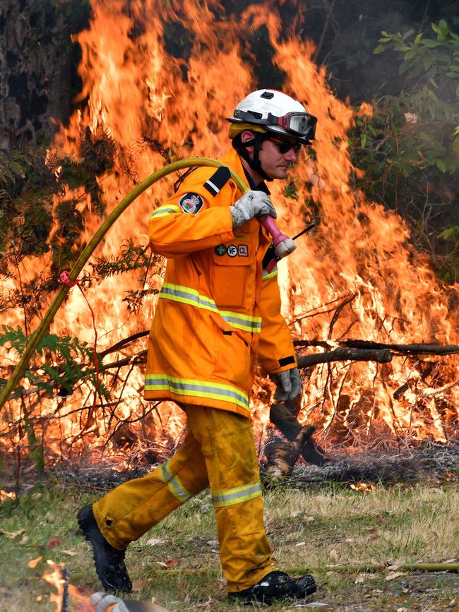 A firefighter conducts back burning on the NSW Central Coast.