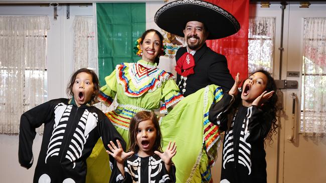 The Cairns Mexican community will celebrate this weekend, when the city's first dedicated Mexican festival is held at the Cairns German Club on Saturday. Carolina Contreras and Uriel Navarro, pictured with child skeletons Ilaw Holland, 11, Rafael Aeberli, 6, and Mayari Holland, 9, will perform Mexican and Latin dances at the festival, which runs at the German Club from 5pm onwards. Picture: Brendan Radke