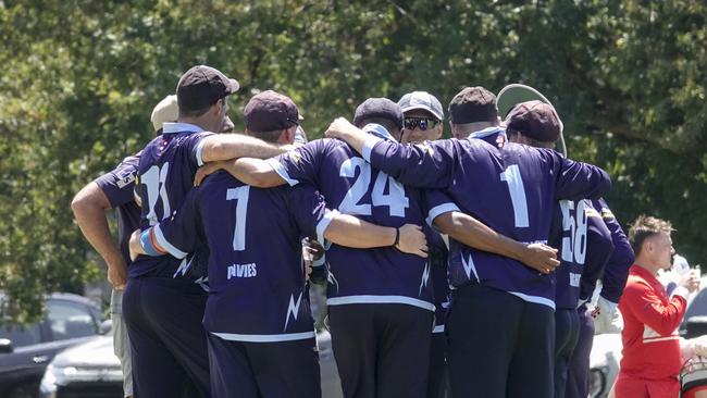 Buckley Ridges players gather after a wicket. Picture: Valeriu Campan