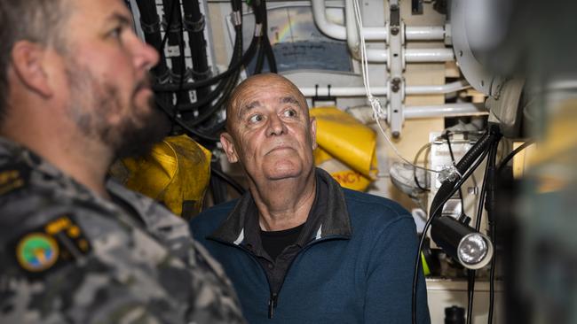 Mr Garry Ivory, nephew of Ordinary Seaman Edward ‘Teddyy’ Sheean, VC, watches Royal Australian Navy sailor Chief Petty Officer Medic Kerrin Lyon steer the submarine HMAS Sheean during a sea-ride off Tasmania's north coast. Picture: LS Daniel Goodman/ Australian Defence Force