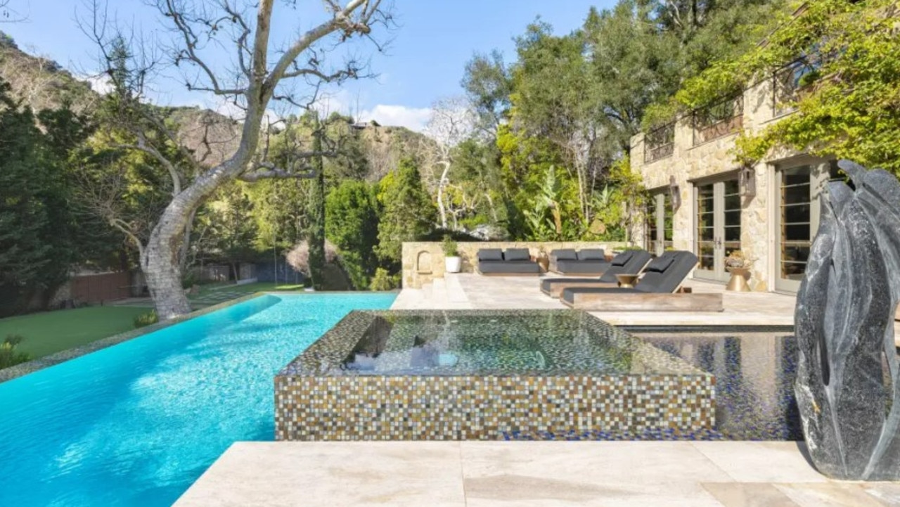 The pool and hot tub. Photos via Realtor/Carolwood Estates