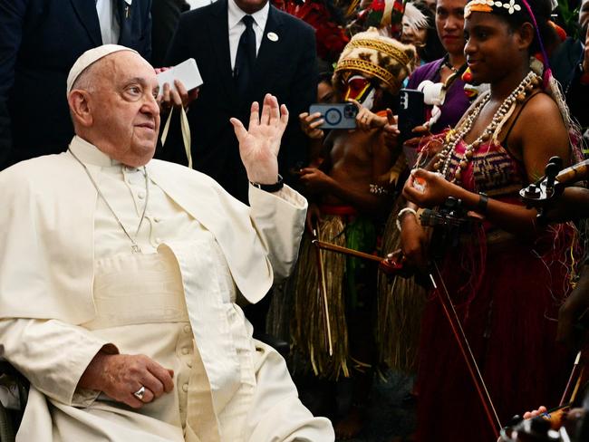 Pope Francis meets with musicians following a welcome ceremony in Port Moresby, Papua New Guinea on September 7, 2024. (Photo by Tiziana FABI / AFP)