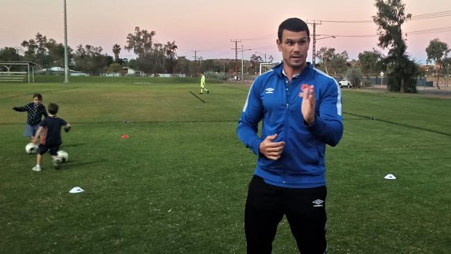 John Tambouras giving instructions at a coaching clinic in Alice Springs. Picture: Justin Raymond