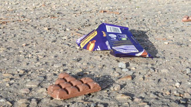 Police have followed a trail of lollies and chocolate bars to arrest four teenage boys who allegedly robbed two service stations in August. Pic: AAP/Brenton Edwards