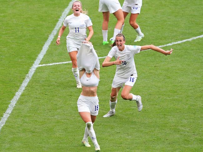 England's striker Chloe Kelly takes off her shirt as she celebrates with teammates after scoring their second goal during the UEFA Women's Euro 2022. Picture: AFP