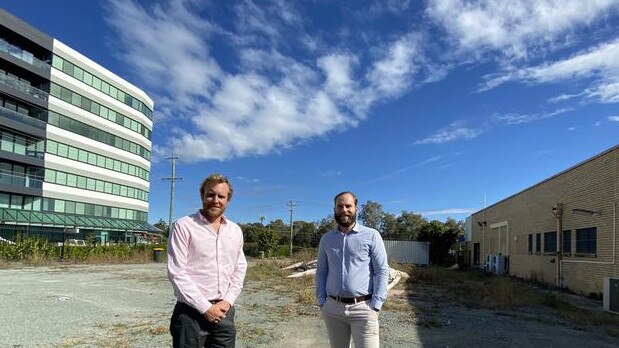 Simon Rogers, left, from Rogerscorp at the medical hub site in Springwood before construction started.