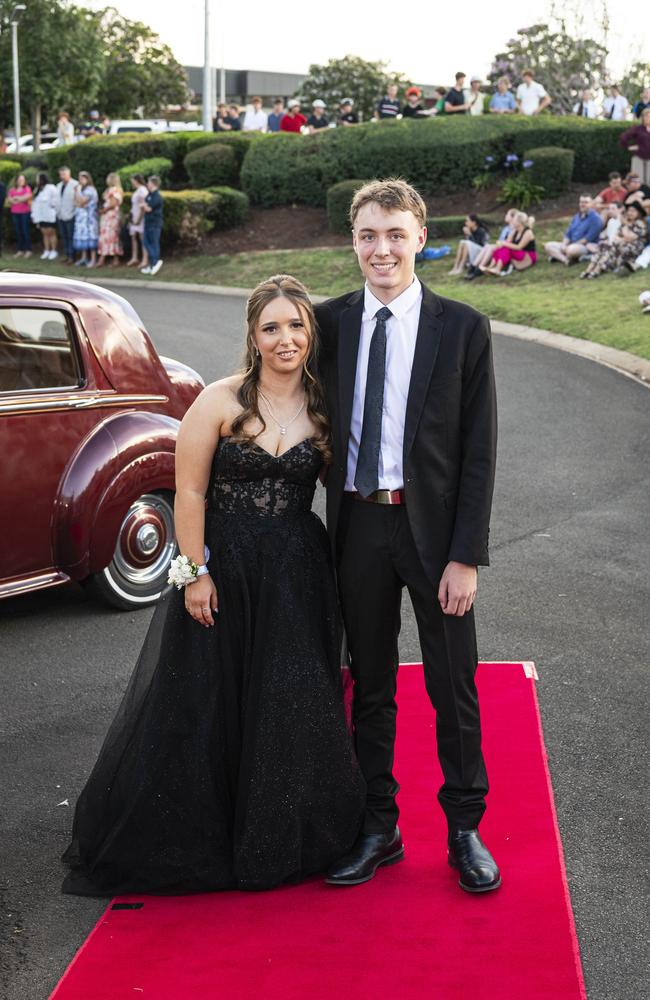 Graduate Amelie Mitchell and partner Cooper Elgayar arrive at Mary MacKillop Catholic College formal at Highfields Cultural Centre, Thursday, November 14, 2024. Picture: Kevin Farmer