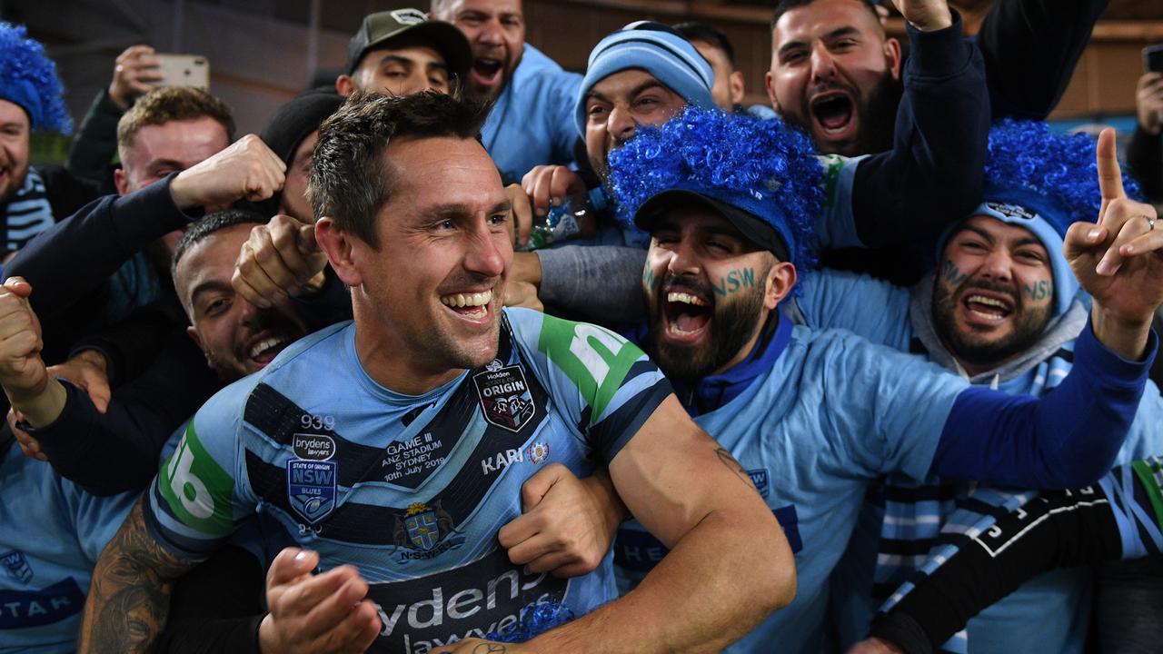 Mitchell Pearce celebrates with Blues supporters.