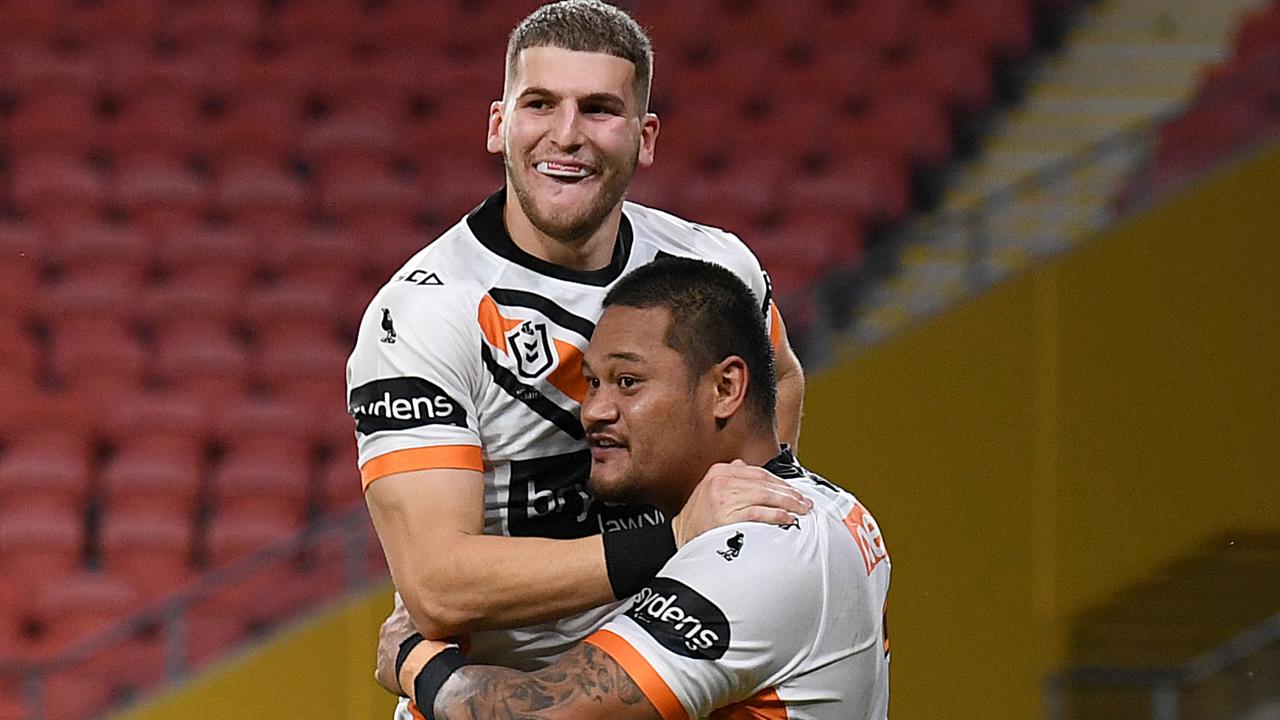 Adam Doueihi (left) celebrates with Joseph Leilua of the Tigers.