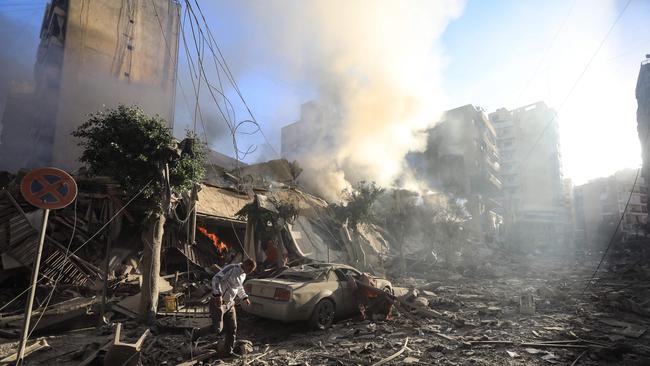 A man walks amid the rubble of a building hit in an Israeli air strike in Beirut's southern suburbs on October 3, 2024. Picture: AFP