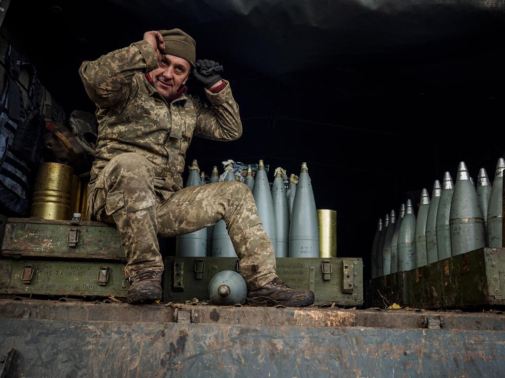 A Ukrainian artilleryman sits in a military truck at a position on the front line near the town of Bakhmut, in eastern Ukraine's Donetsk region.