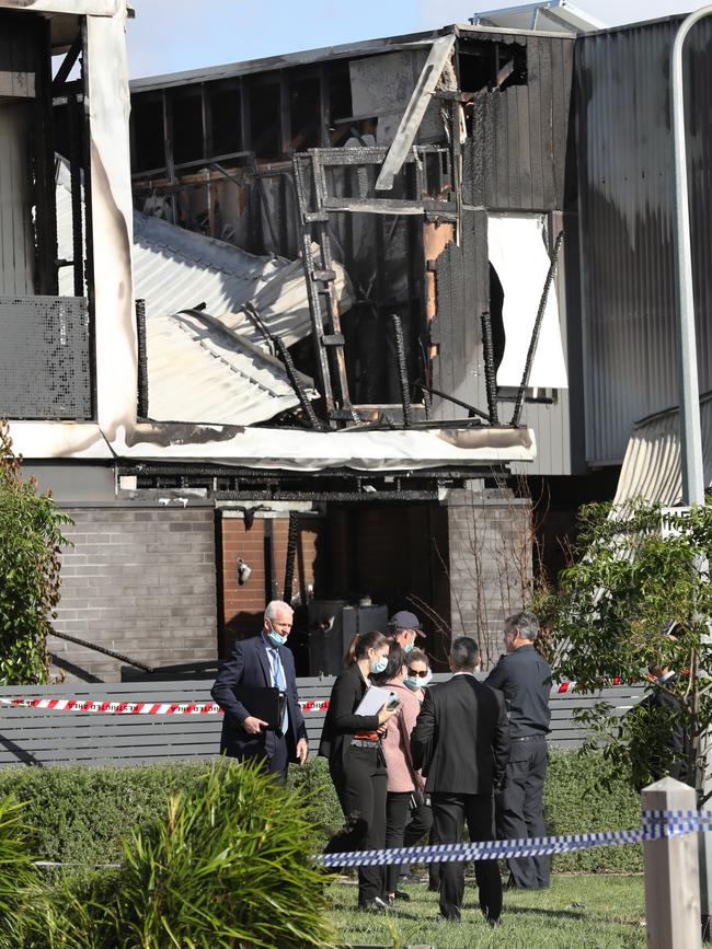 Police and firefighters at the scene of the fire.