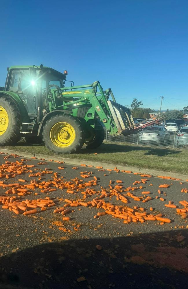 About three tonnes of carrots have been spilt on the road at the roundabout at Bass Highway and Moriarty Road, Latrobe, prompting police to advise motorists to avoid the area. Picture: Facebook/Shea Edmunds