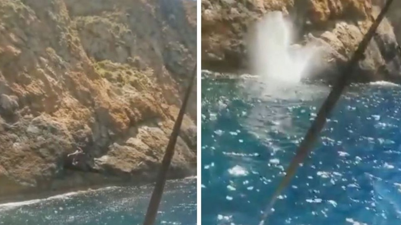The man did not clear the rocks with his leap and crashed into the water after clipping the rocks. Pictures: CEN/australscope