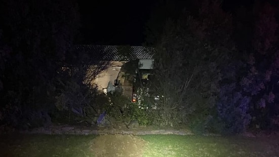 The van crashed into the front window of the home about 11pm while the occupants were watching TV. Picture: SA Police