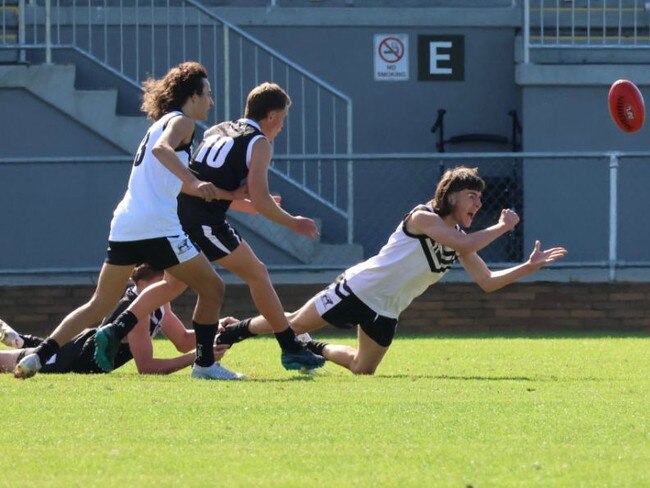 Riverina's Harrison Westmoreland gets a handball away during the CHS All Schools AFL trials. Picture: Contributed