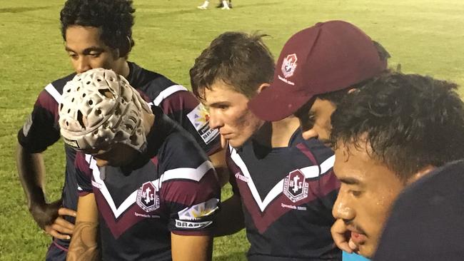 Ipswich SHS match winner Lachlan Williamson, centre, ponders his late goal while listening to his coach after the Langer Cup match.