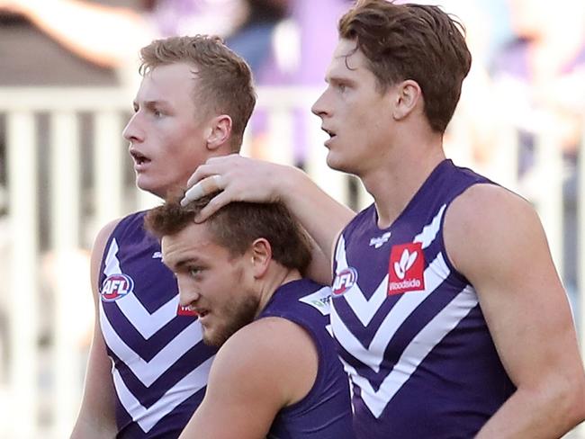 PERTH, AUSTRALIA - AUGUST 15: Josh Treacy of the Dockers celebrates after scoring a goal during the 2021 AFL Round 22 match between the Fremantle Dockers and the West Coast Eagles at Optus Stadium on August 15, 2021 in Perth, Australia. (Photo by Will Russell/AFL Photos via Getty Images)