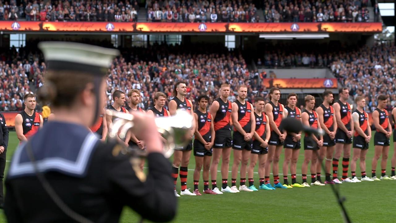Essendon players during Anzac Day  pre-match ceremony.