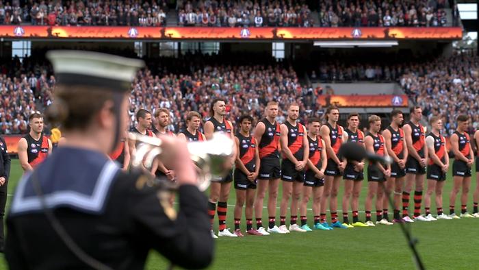Essendon players during Anzac Day  pre-match ceremony.