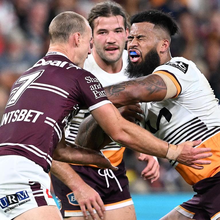 Payne Haas fends off Daly Cherry-Evans during the Broncos’ Magic Round win.