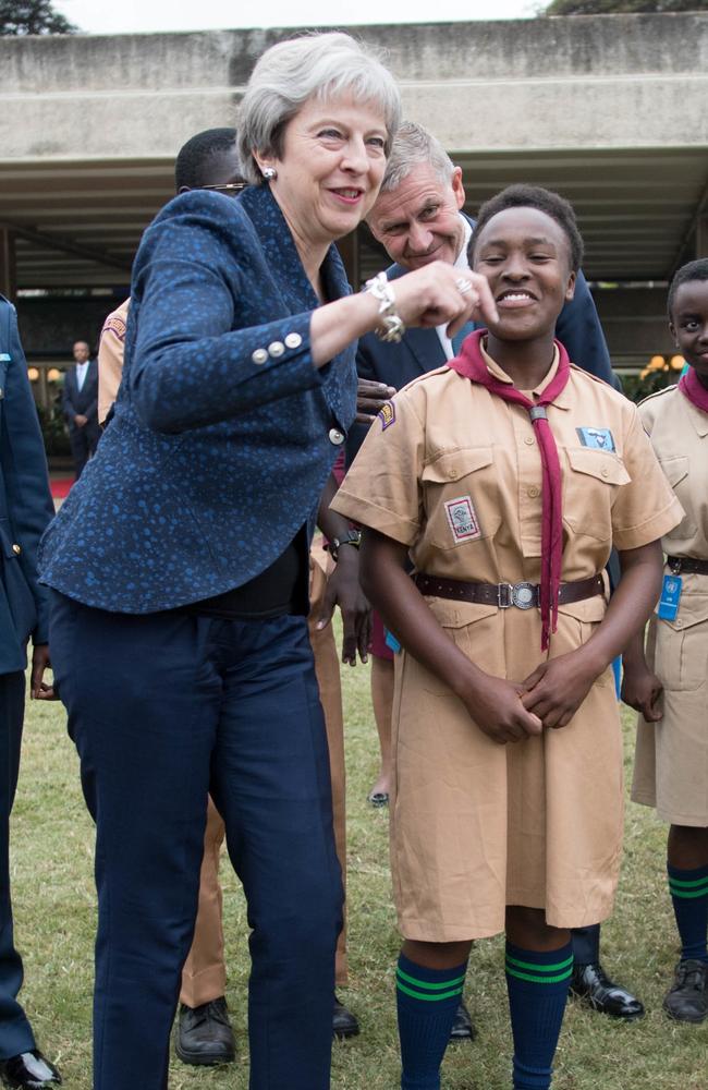 Prime Minister Theresa May breaks into dance while meeting with scouts at the United Nations offices in Nairobi on the third day of her visit to Africa. Picture: Stefan Rousseau / Getty Images