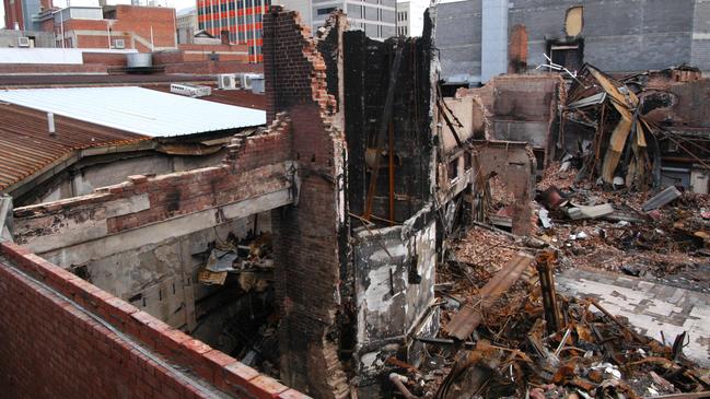 The view from the rear of Ellison Hawker newsagency of the burnt-out building and pile of rubble which was once the Myer Hobart Liverpool Street store 