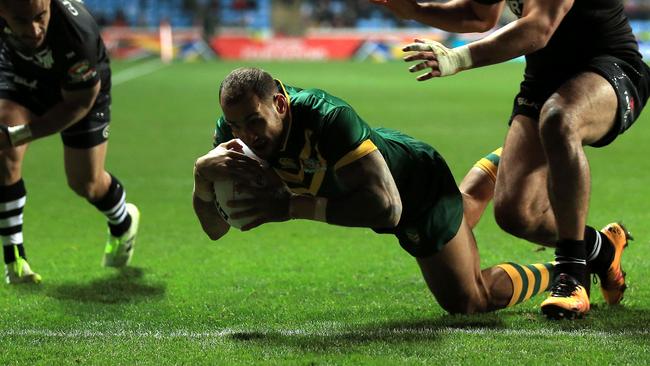 Blake Ferguson of Australia scores a try.