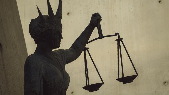 BRISBANE , AUSTRALIA - NewsWire Photos - BRISBANE , JUNE 24 2024: Generic photo of the scales of justice stature outside Brisbane Supreme Court in the Brisbane CBD. Picture: NewsWire / Glenn Campbell