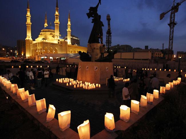 13/04/2009 WIRE: Lebanese light candles during a vigil marking the 34th anniversary of the 1975-90 civil war and to honor the victims of that war, at the Martyrs square in downtown of Beirut, Lebanon, on Monday April 13, 2009. When the Lebanese civil war ended in 1990, the toll was colossal: 150,000 people killed, about half a million wounded and nearly a similar number displaced. One quarter of the population, or about 900,000 people, had left the tiny Arab country. (AP Photo/Bilal Hussein)