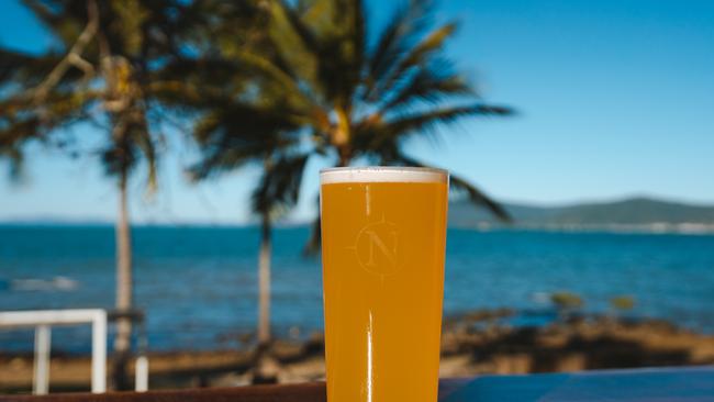 Northerlies Beach Bar & Grill, Whitsundays Beer with a view. Photo: Reuben Nutt Tourism Queensland Escape 13 February 2022 Destination – Whitsundays, Queensland