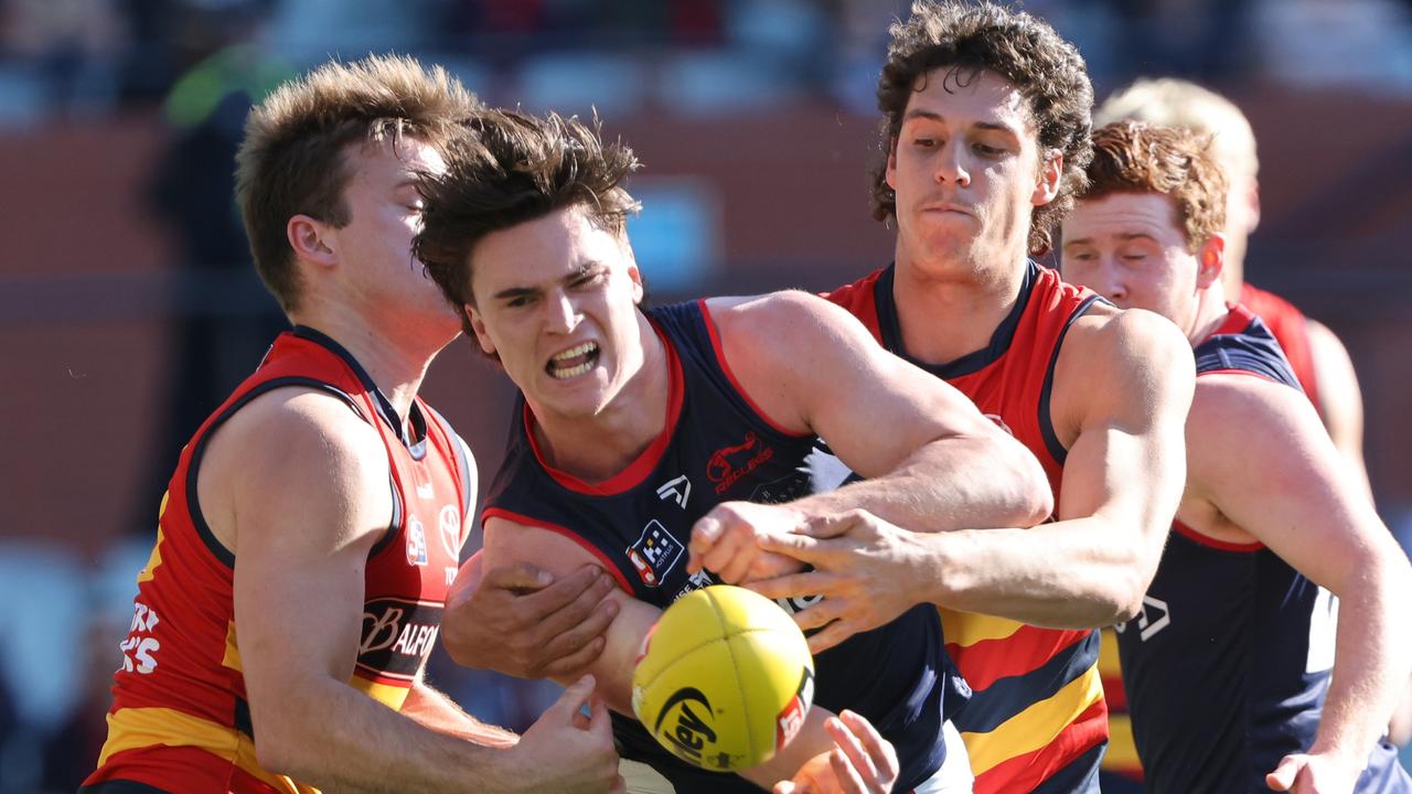 Nick Lowden (centre) in action during the 2022 SANFL qualifying final match between Adelaide and Norwood. Picture: SANFL / David Mariuz