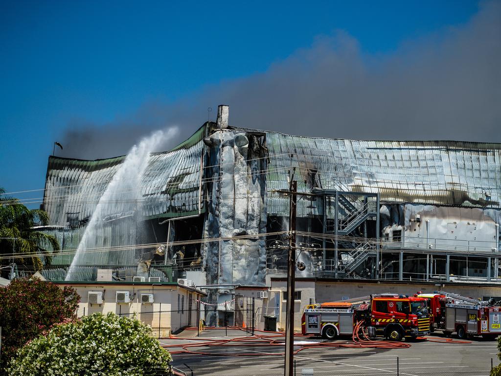 Emergency services continue to fight the fire burning at the Thomas Foods abattoir in Murray Bridge. Picture: AAP / Roy Vandervegt