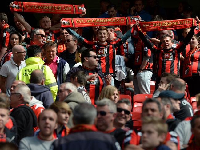 A few Bournemouth fans show their pride during the evacuation. Picture: AFP / Oli Scarff