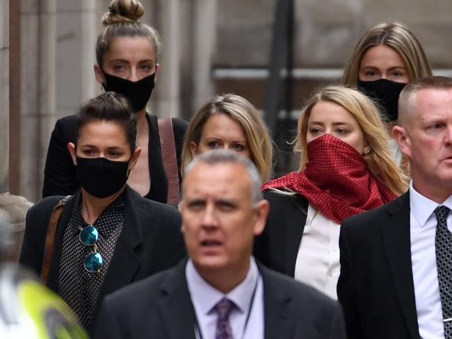 Amber Heard has been supported in court by her sister Whitney (back left), her lawyer Jennifer Robinson (centre), and her girlfriend Bianca Butti (left). Picture: Getty Images