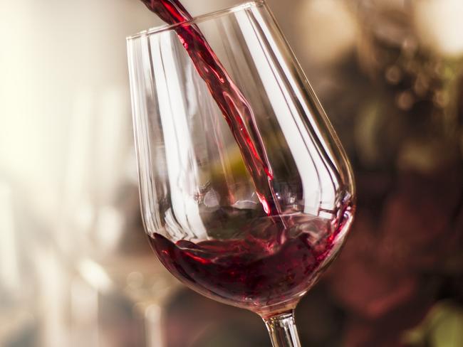 red wine pouring in a restaurant