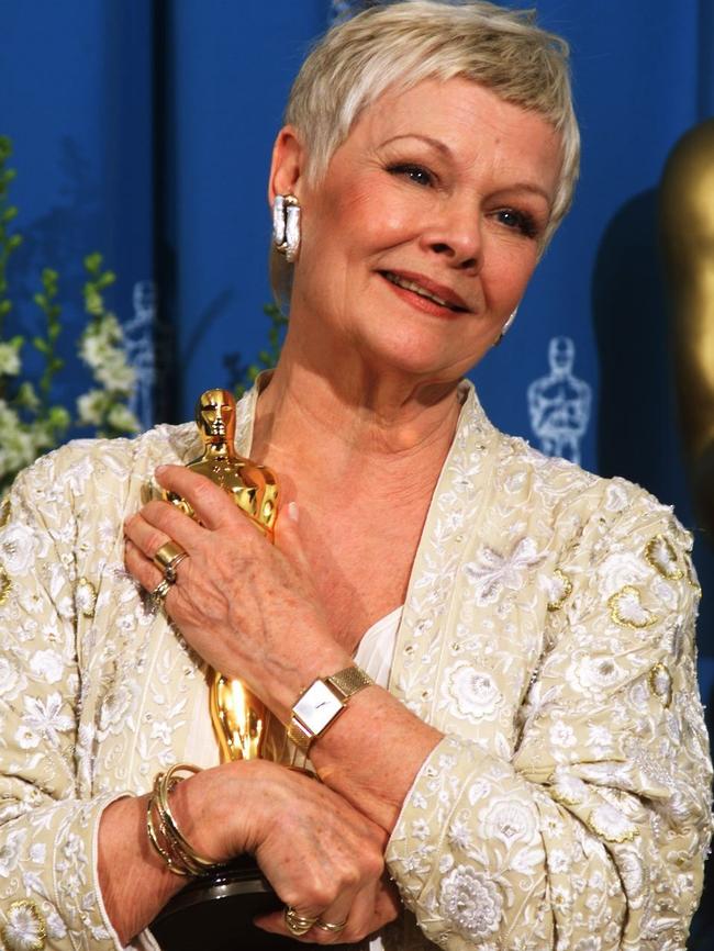 Dench with her Oscar after winning Best Supporting Actress. Picture: AFP