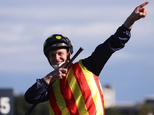 Jockey James McDonald reacts after riding the winning horse Nature Strip during The Everest. Picture: David Gray/AFP