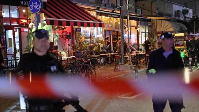 Members of Israeli security forces stand guard at the site of a stabbing attack in Tel Aviv on Wednesday. Picture: AFP