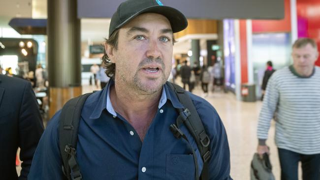 Outback Wrangler Matt Wright walks to his flight at Sydney Airport. Picture: Liam Mendes / The Australian