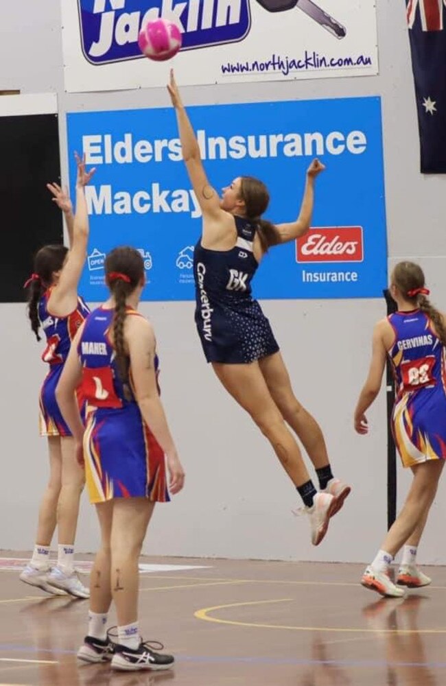 Netball rising star Holly Comyns in action (centre).