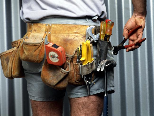 UNDATED : Generic pic of a Builder wearing his utility belt - work tools tape measure