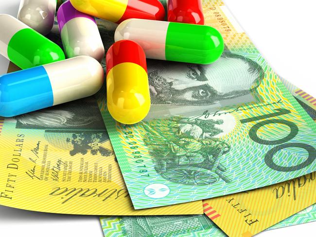 Colorful capsules on Australian Dollar notes. Isolated on white.For more money and finance images: