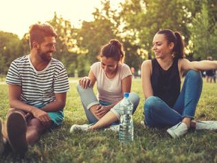 Three beautiful friends sitting in the park,laughing and having a great time. Picture: iStock